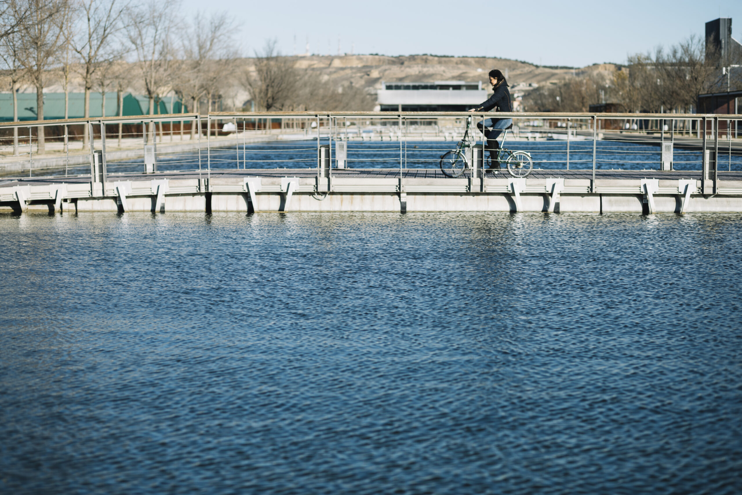 modern-woman-riding-bike-city steam is water